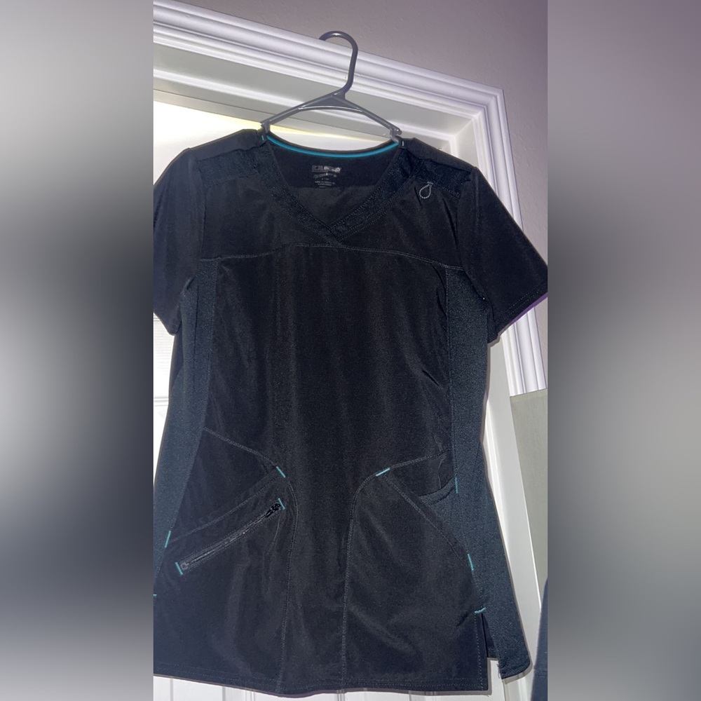 Black scrubs top and bottom with blue accents on them